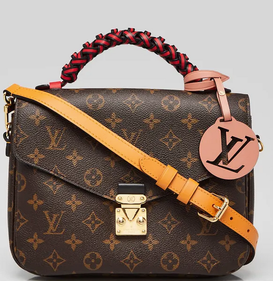 Borsa Pochette Metis in tela Monogram con manico intrecciato